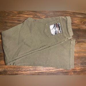 Mid Rise Cello Brand Pull On Flares . Olive color size large 32 in length